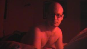Josh 3rd Dec 2010 - just a pic of me waiting in the red glow of my new neons in my room, ready for a nice raw cock or two in my chap enshrined bubble butt.