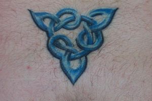 This is my bitch tat on my lower back.  the point was supposed to be right at my ass crack, but I think the breeder boy that was doing my tat didn't want to get that close.  LOL  It's about half an inch above.  This is the only pic I have of this tat for 