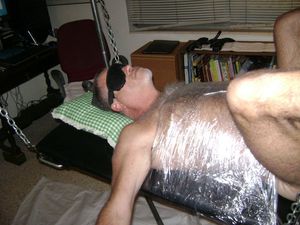 Bound in plastic while blindfolded