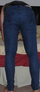 shiny black bodysuit and skinny jeans