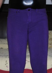 shiny black bodysuit and tight purple pants