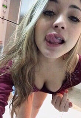 Evil Teen FemDom licking her lips and giving me the finger copy.jpg