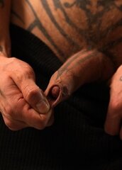 Uncut foreskin of a tattooed cock.jpg